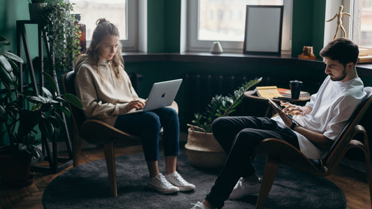 A couple working together focused to improve their productivity on their work.